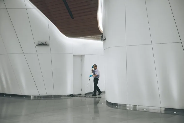 A Peache professional mopping a commercial building lobby