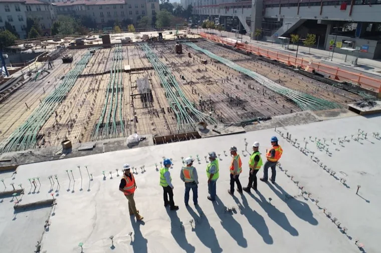 Post-construction site being cleaned by crew