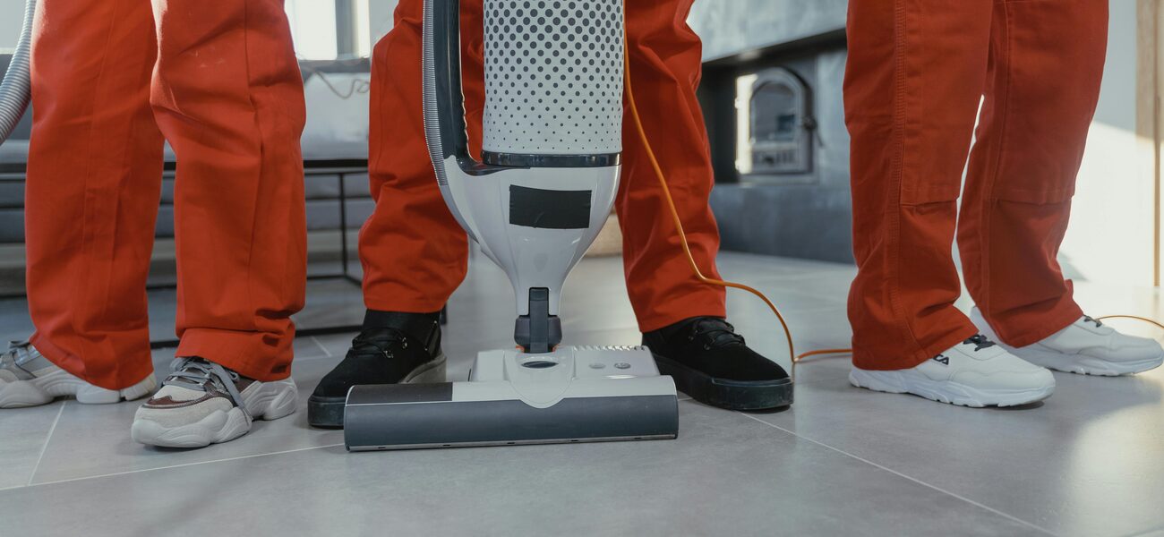 Peache crew vacuuming a commercial floor